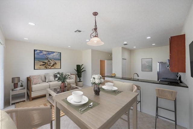 263 Provence Pl, Vero Beach, FL 32960 - dining room featuring recessed lighting and light tile patterned floors