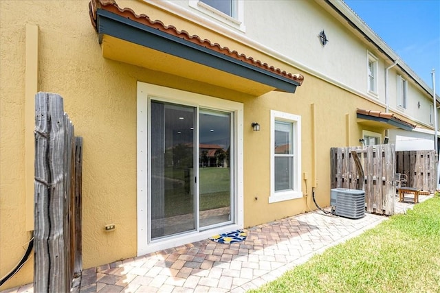 263 Provence Pl, Vero Beach, FL 32960 - view of exterior entry featuring a patio area and stucco siding