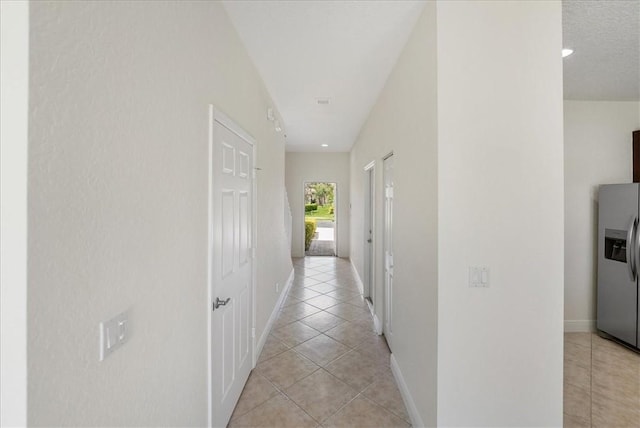 263 Provence Pl, Vero Beach, FL 32960 - hallway with light tile patterned flooring