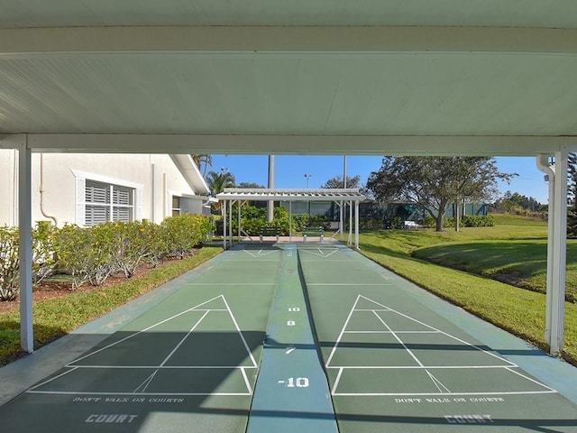 surrounding community featuring shuffleboard and a lawn