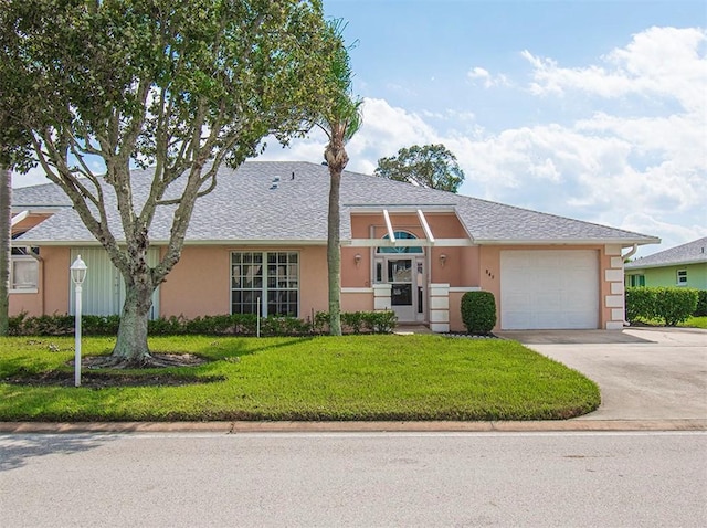 single story home with driveway, stucco siding, a garage, and a front yard