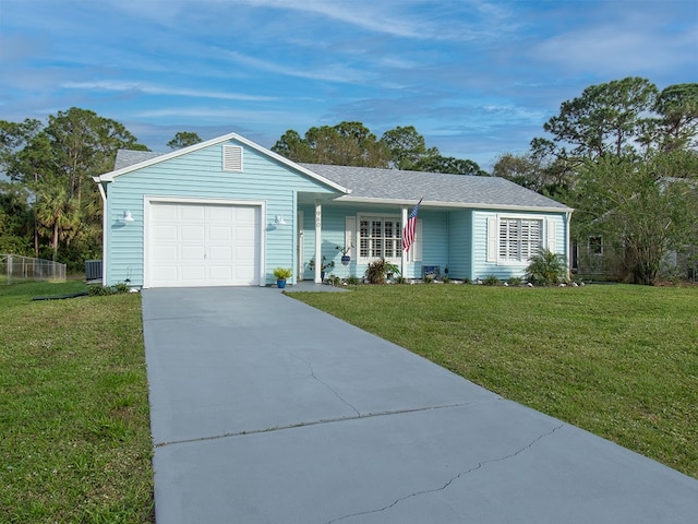 single story home featuring a garage and a front yard