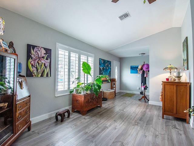 entrance foyer featuring ceiling fan, light wood-type flooring, and lofted ceiling