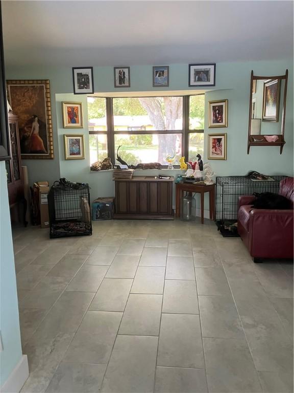 living area featuring tile patterned flooring