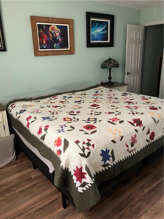 bedroom with wood finished floors