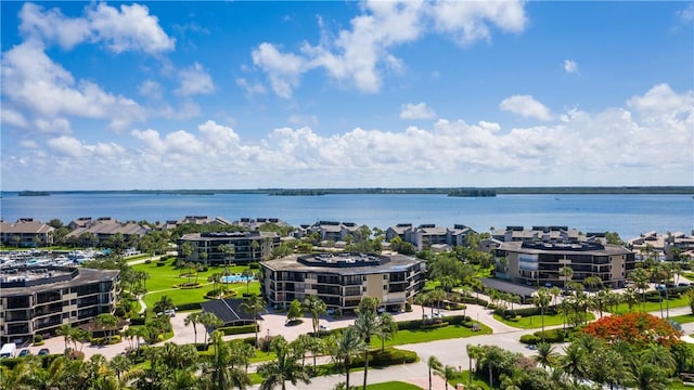 birds eye view of property with a water view