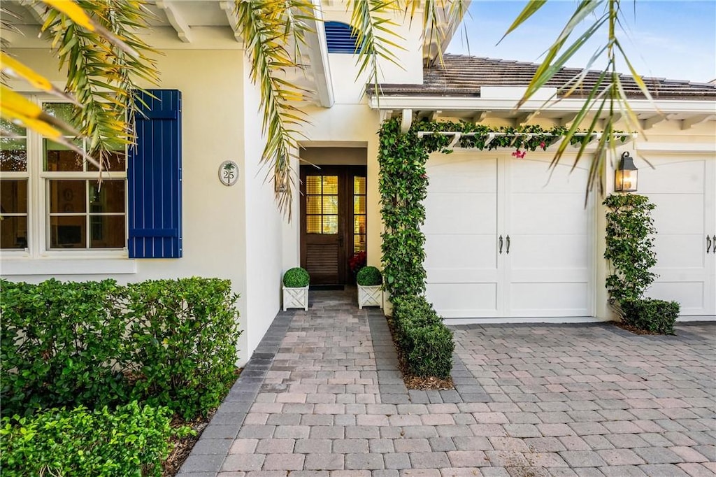 view of exterior entry featuring a garage