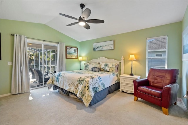 bedroom featuring lofted ceiling, light carpet, access to exterior, and a ceiling fan