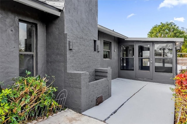 entrance to property with a patio