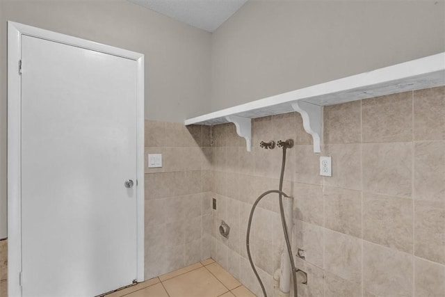 bathroom with tile patterned floors