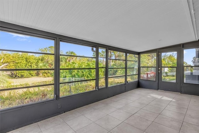 unfurnished sunroom with vaulted ceiling