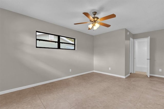 unfurnished room with ceiling fan and light tile patterned flooring