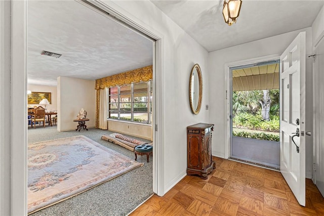 entrance foyer with light parquet flooring