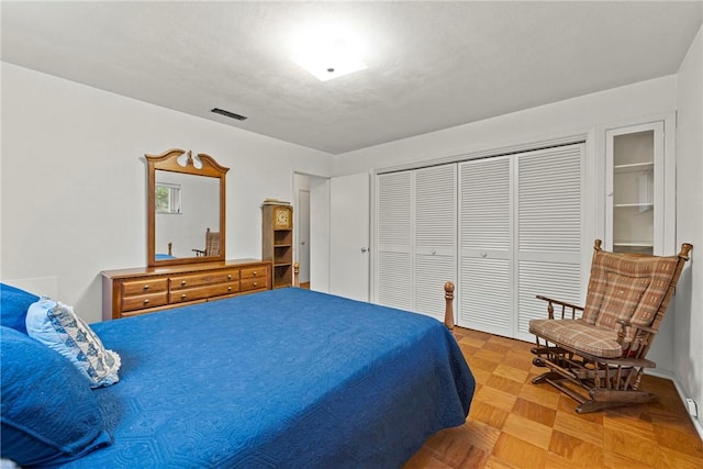 bedroom with parquet flooring