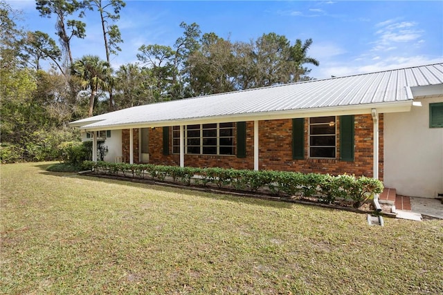 ranch-style home with a front lawn