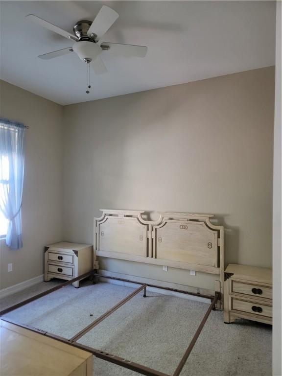 4295 55th St, Vero Beach, FL 32967 - unfurnished bedroom with baseboards and a ceiling fan