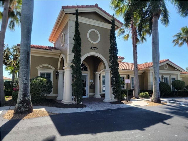 4295 55th St, Vero Beach, FL 32967 - mediterranean / spanish-style house with a tiled roof and stucco siding