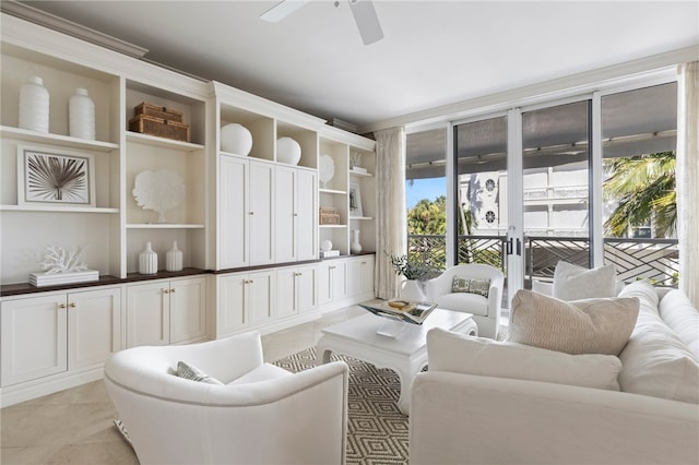 tiled living room featuring a healthy amount of sunlight and ceiling fan