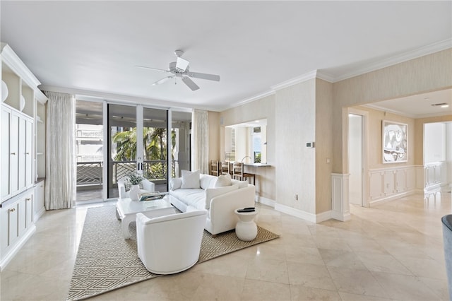 living room featuring ceiling fan and ornamental molding