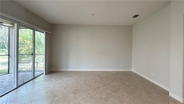 empty room with light tile patterned flooring