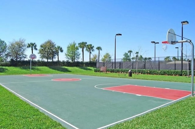 view of basketball court featuring a lawn