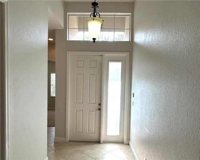 foyer entrance featuring light tile patterned floors