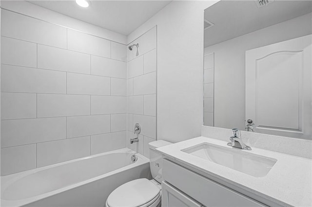7724 104th Ave, Vero Beach, FL 32967 - bathroom featuring toilet, vanity,  shower combination, and recessed lighting