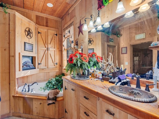 bathroom with sink, wooden ceiling, a bathtub, and wood walls