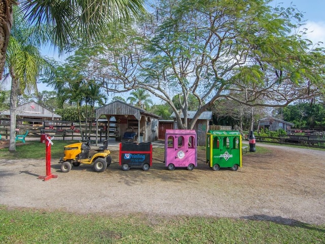 view of jungle gym with an outbuilding