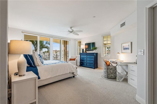 bedroom with ceiling fan, access to exterior, and light carpet