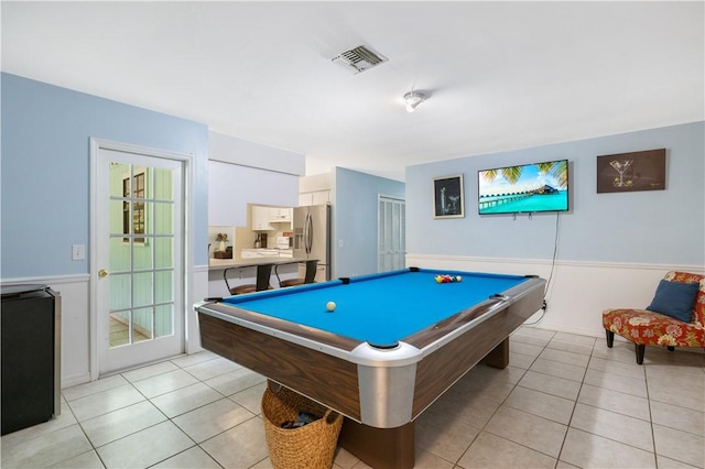 1635 71st Ct, Vero Beach, FL 32966 - game room with light tile patterned flooring, a wainscoted wall, and billiards
