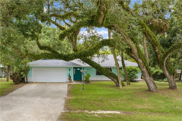 1635 71st Ct, Vero Beach, FL 32966 - ranch-style house with a garage, concrete driveway, a front lawn, and roof with shingles