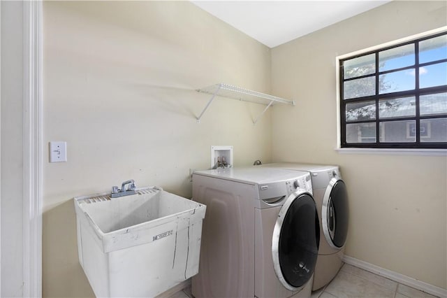 1635 71st Ct, Vero Beach, FL 32966 - laundry area with separate washer and dryer and light tile patterned floors
