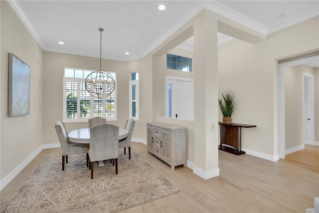 dining room featuring light wood-type flooring and a notable chandelier