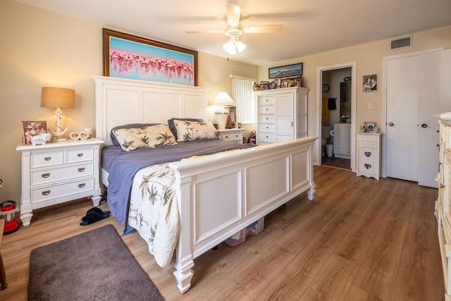 5740 Marina Dr Unit 2, Sebastian, FL 32958 - bedroom featuring washer / clothes dryer, ceiling fan, and light hardwood / wood-style flooring