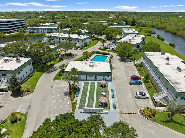 birds eye view of property with a water view