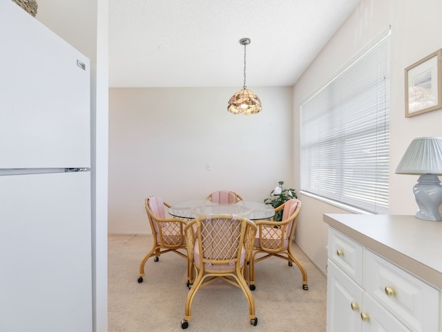 view of carpeted dining area