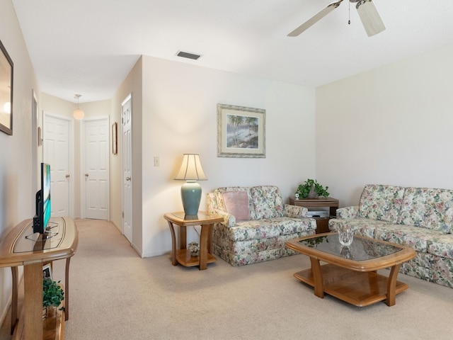 living room with carpet flooring and ceiling fan