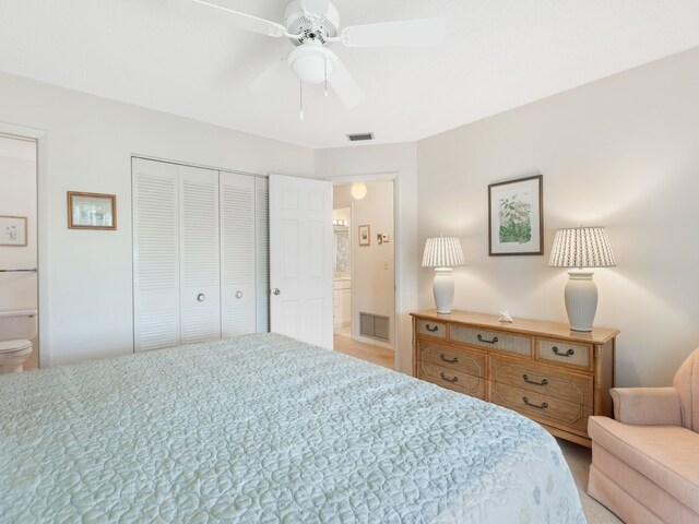 bedroom featuring ceiling fan, connected bathroom, and a closet