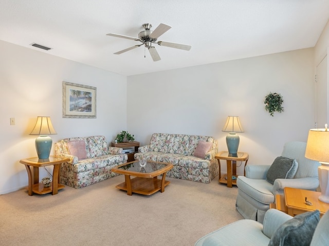 living room featuring ceiling fan and light colored carpet