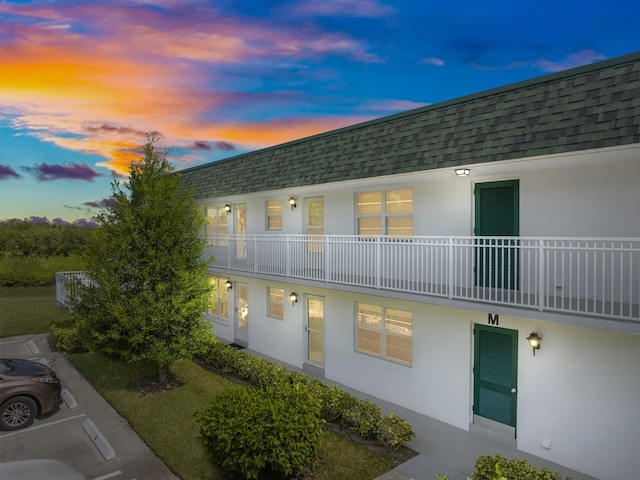 view of outdoor building at dusk