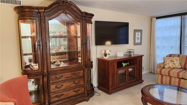 sitting room featuring baseboards and visible vents