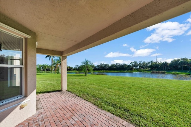 view of patio with a water view