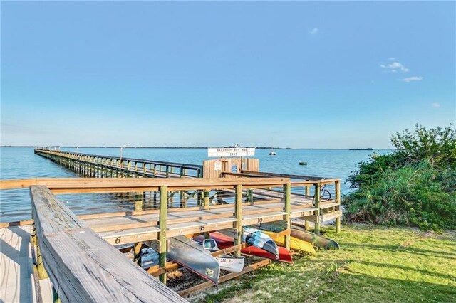 641 Hyacinth Cir, Barefoot Bay, FL 32976 - view of dock featuring a yard and a water view