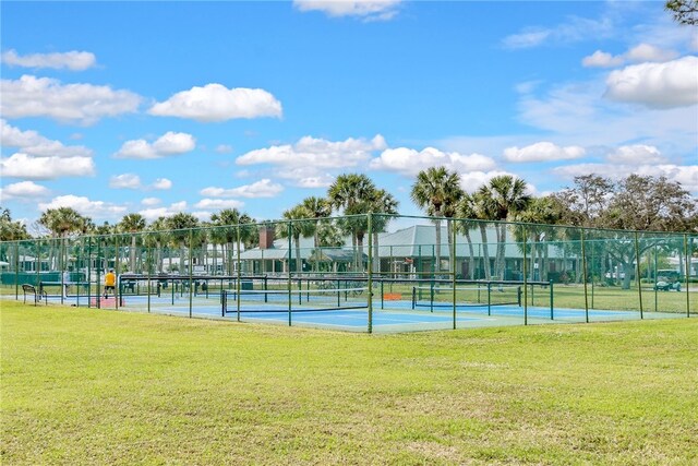 641 Hyacinth Cir, Barefoot Bay, FL 32976 - view of sport court with a yard and fence