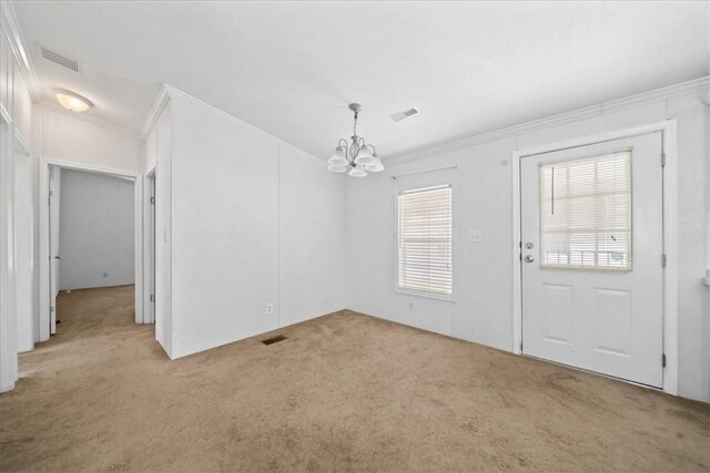 641 Hyacinth Cir, Barefoot Bay, FL 32976 - unfurnished dining area featuring light carpet, ornamental molding, a chandelier, and visible vents