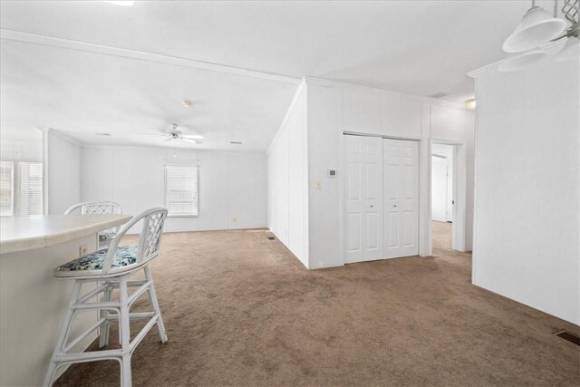 641 Hyacinth Cir, Barefoot Bay, FL 32976 - carpeted living area with a ceiling fan and visible vents