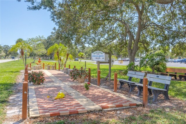 641 Hyacinth Cir, Barefoot Bay, FL 32976 - view of home's community featuring a yard