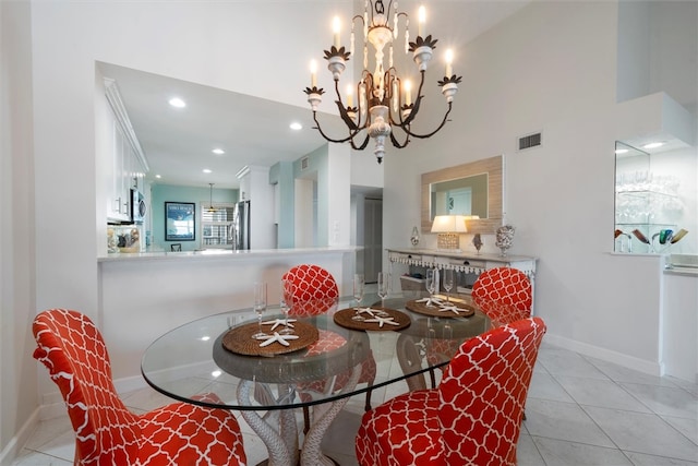 tiled dining area with a chandelier