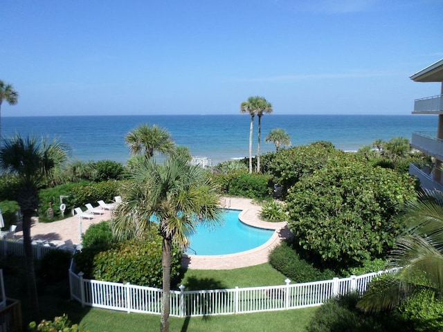 view of pool with a water view